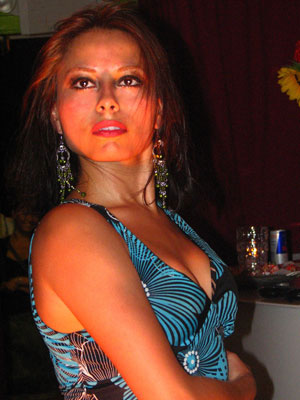 Flamenco dancer Ginette in a blue and black dress performing solea at Cafe Citron