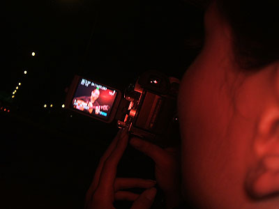 On the drive home: looking over Ginette's shoulder watching a video replay of the concert